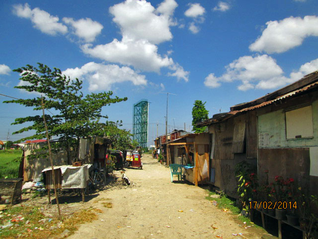 A highway billboard contrasting with the rural foreground